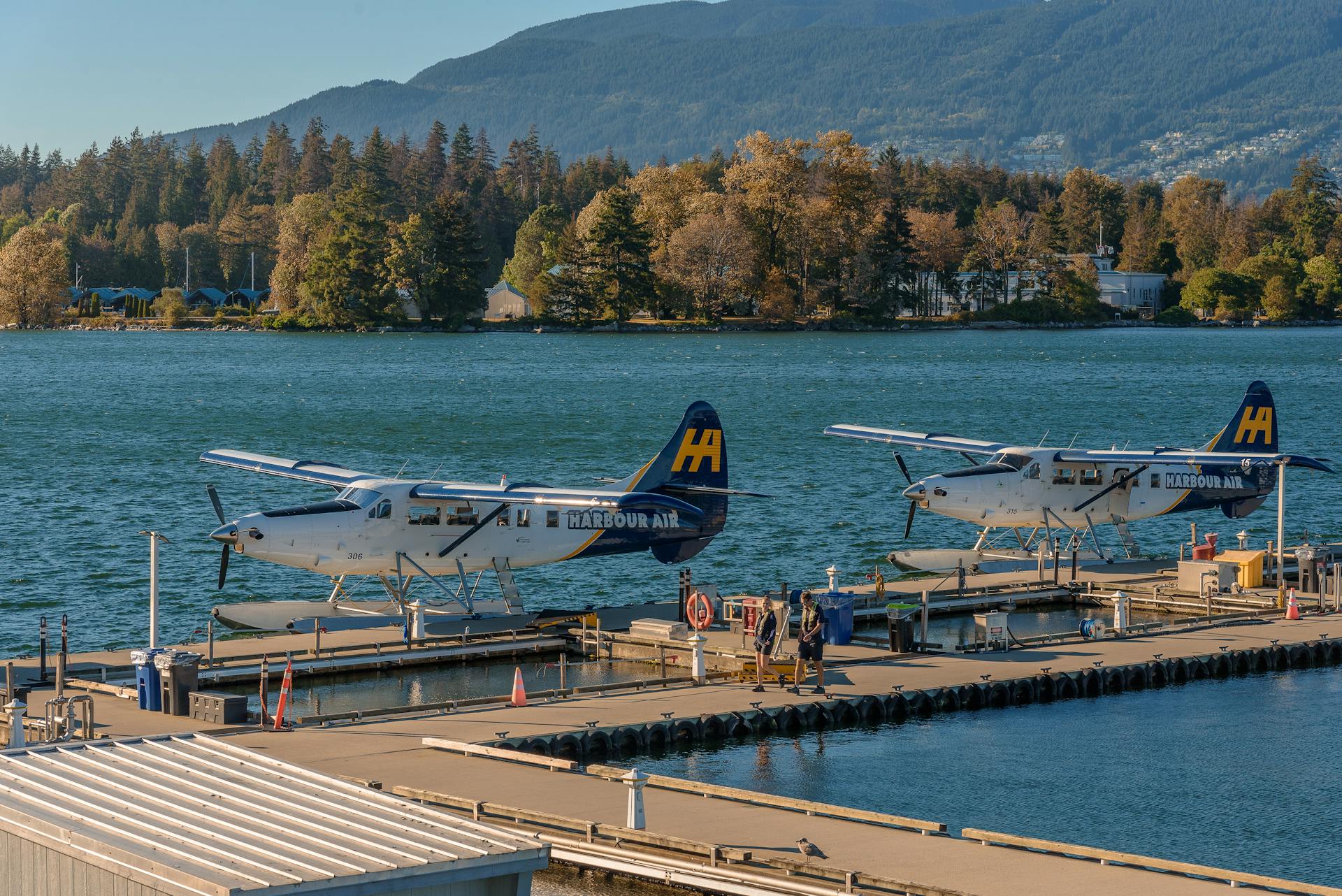 A scenic view of seaplanes docked at a pier in Vancouver, BC, Canada.