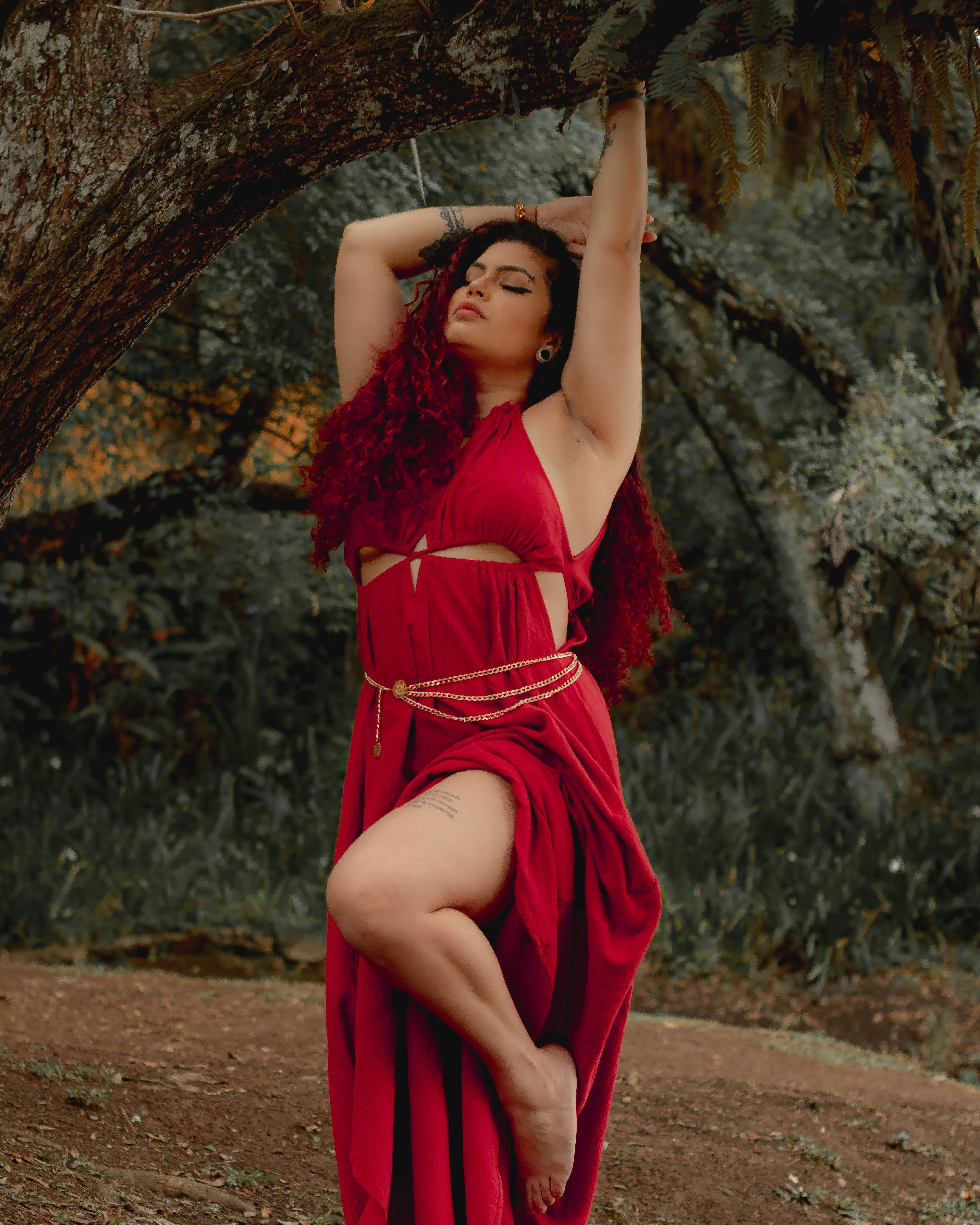 Woman Posing in Red Dress outside a Pagoda · Free Stock Photo