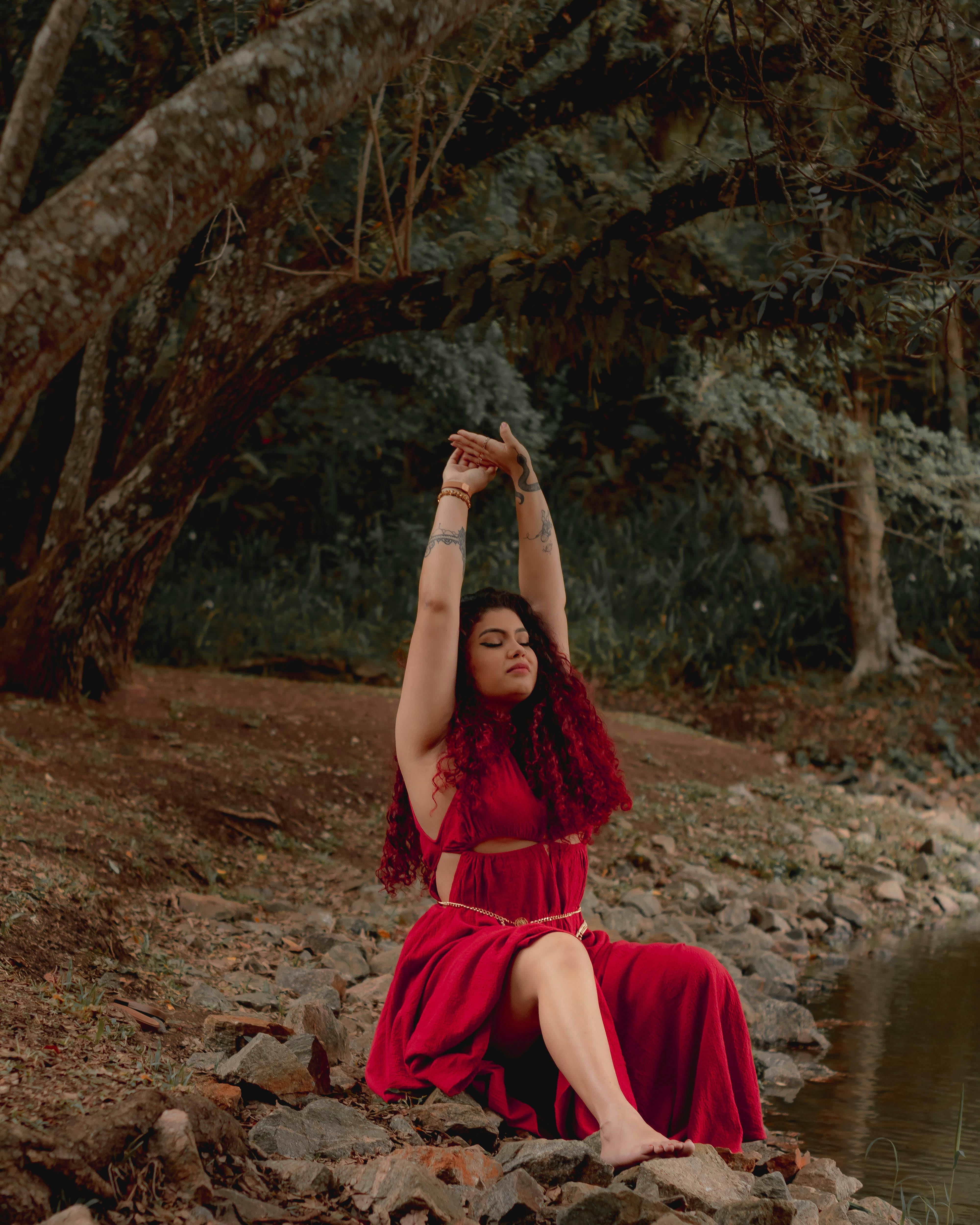 Woman Posing in Red Dress outside a Pagoda · Free Stock Photo