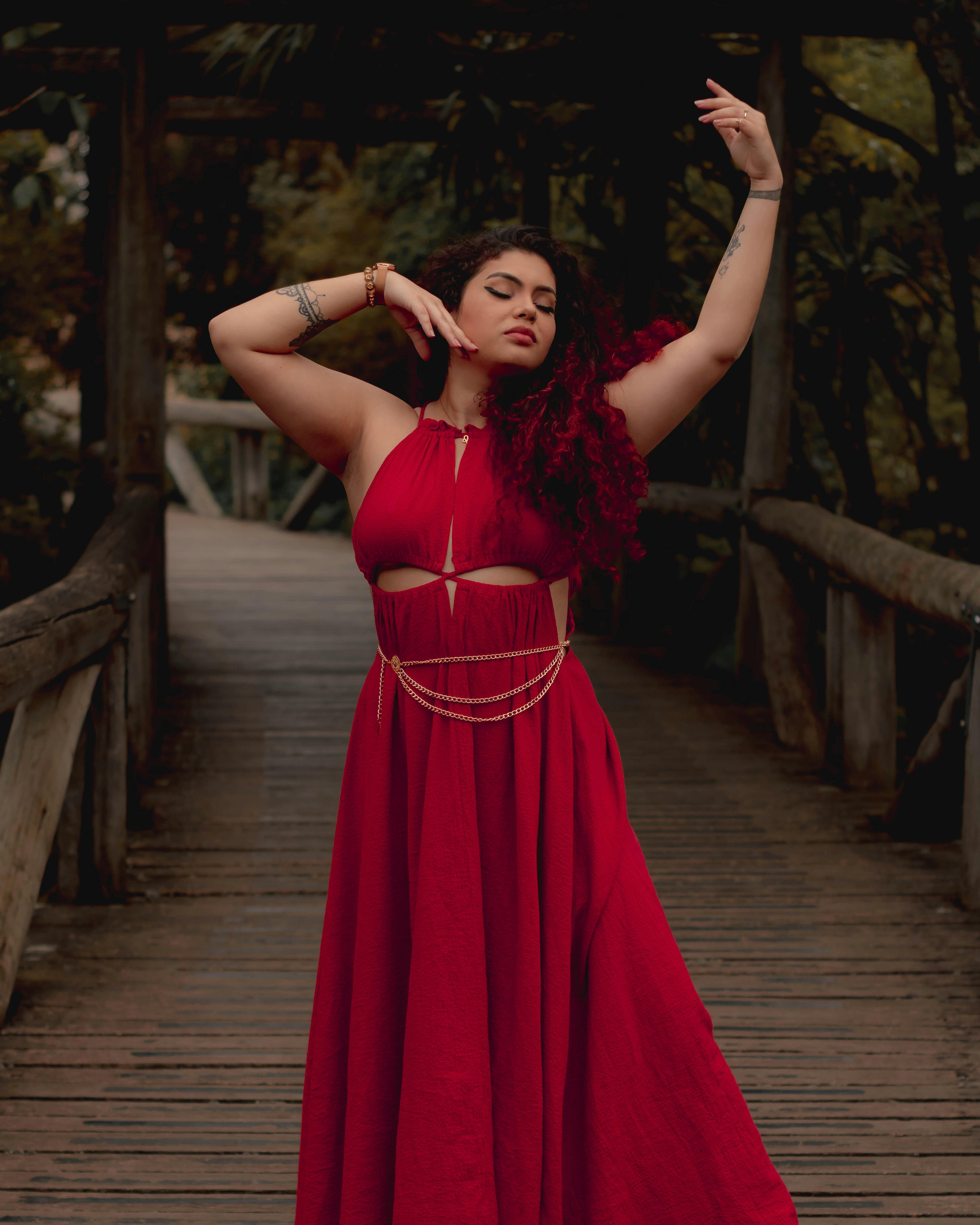 Model Posing in Long Dress with Pink Chiffon · Free Stock Photo