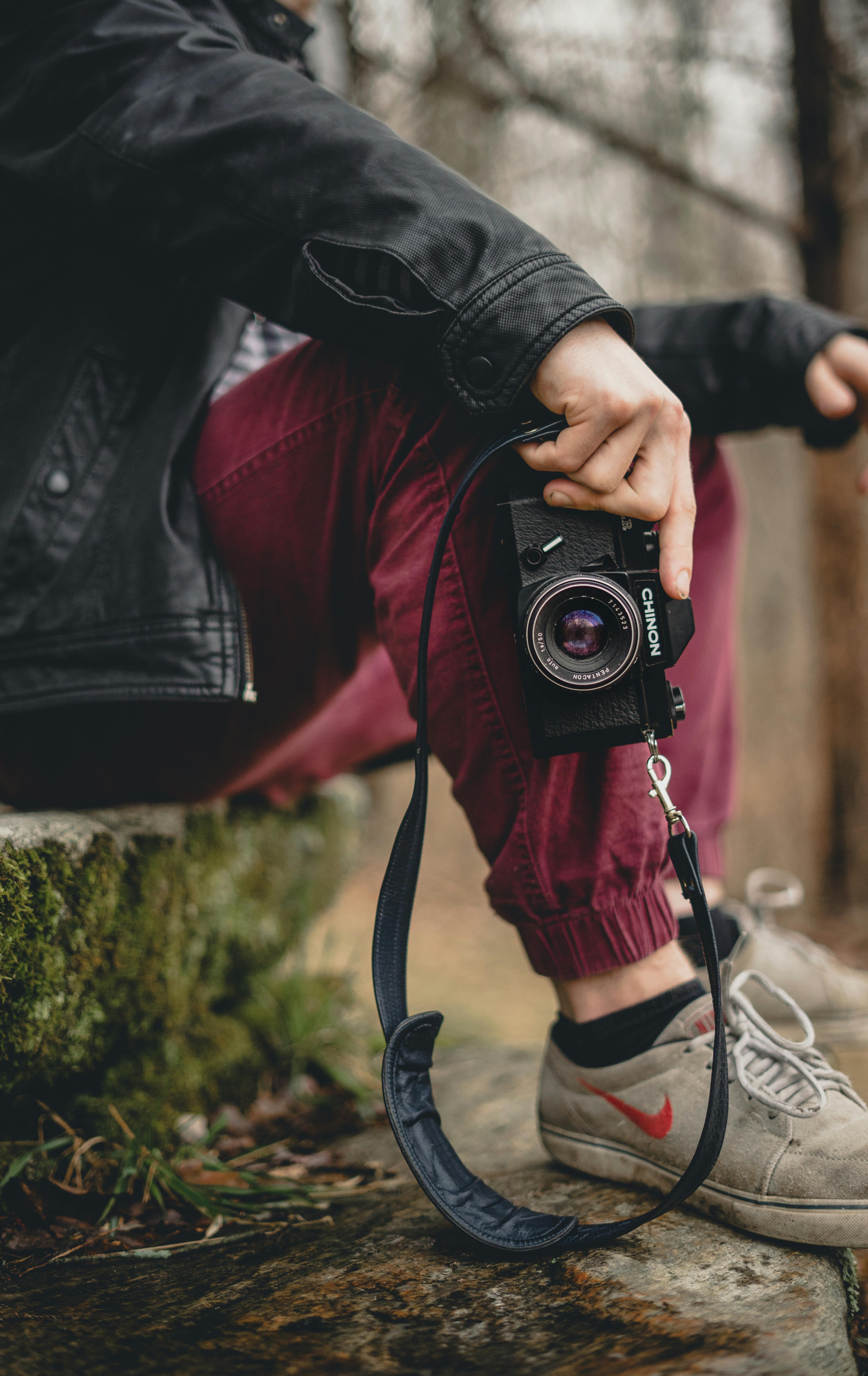 Person Holding Dslr Camera Free Stock Photo