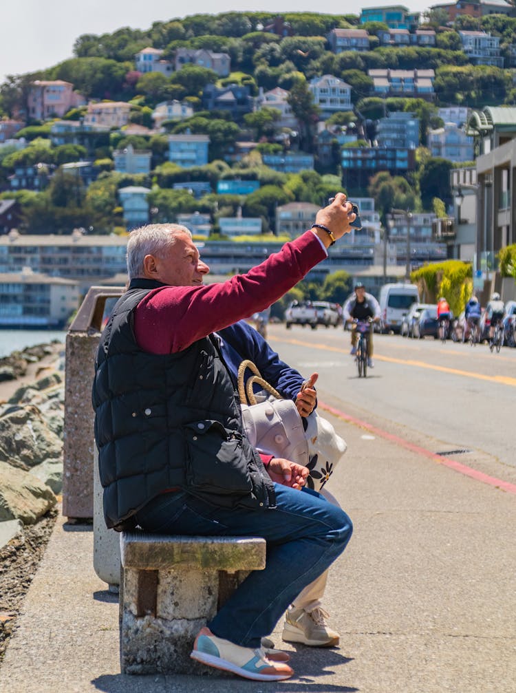 Mature Couple Of Tourists Making Selfie On A Sea Town Waterfront, Sausalito, California