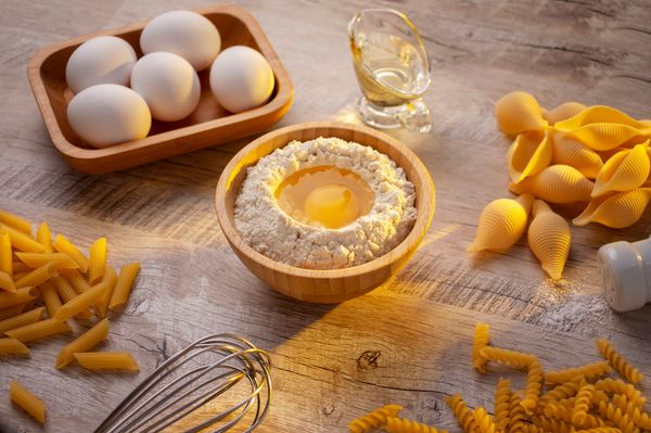 Fresh pasta ingredients with egg yolks and flour — photo by Marcelo Verfe on Pexels