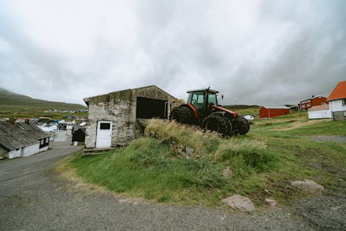 Tractor next to Farmhouse