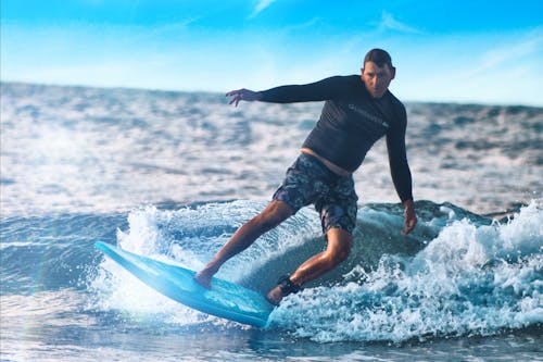 Tourist Surfing on a Blue Surfboard