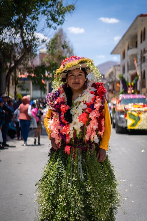 Women in a Dress Made of Grass and Flowers at a Festival