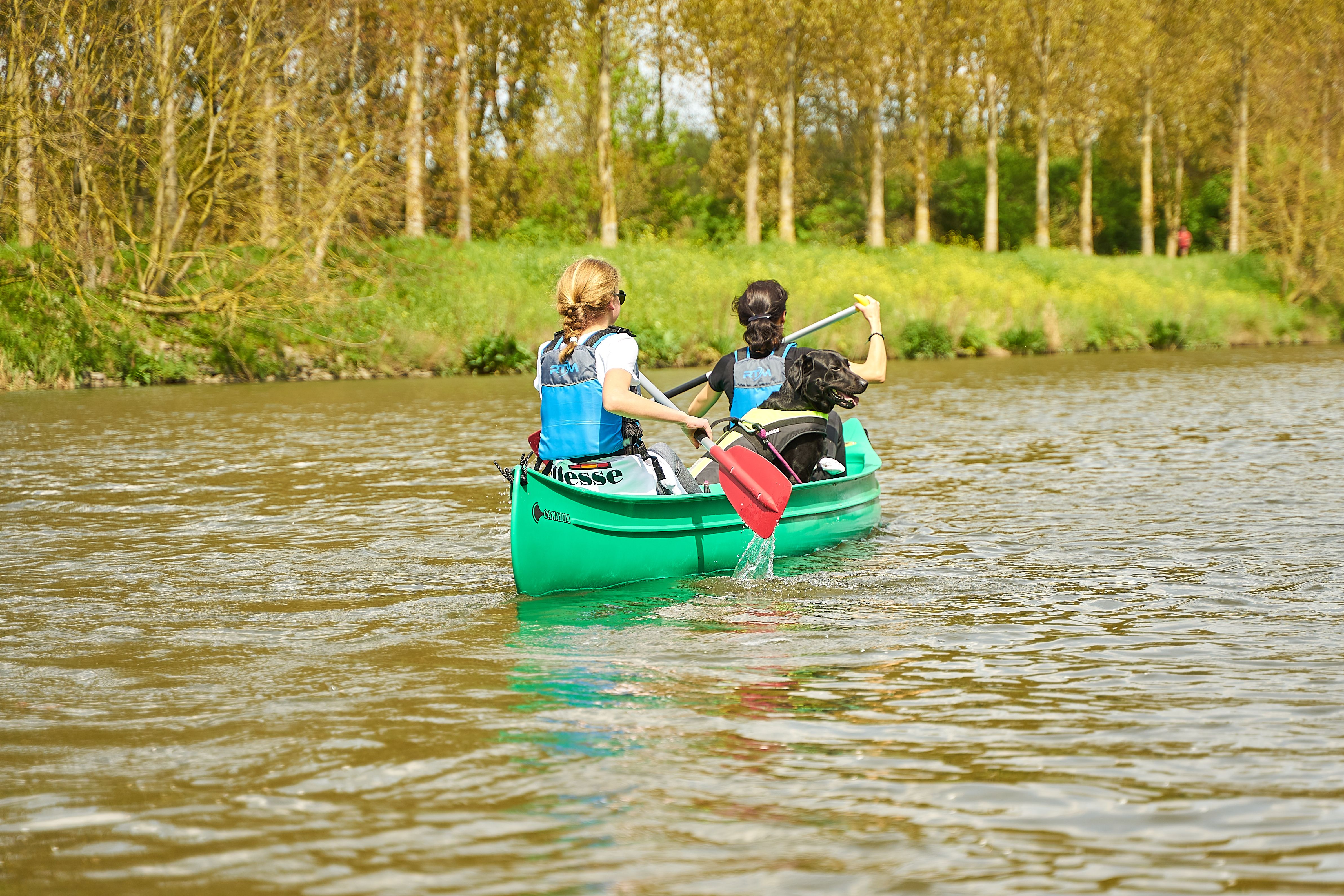 Kayak Riding People Riding on Kayak on Body of Water · Free Stock Photo