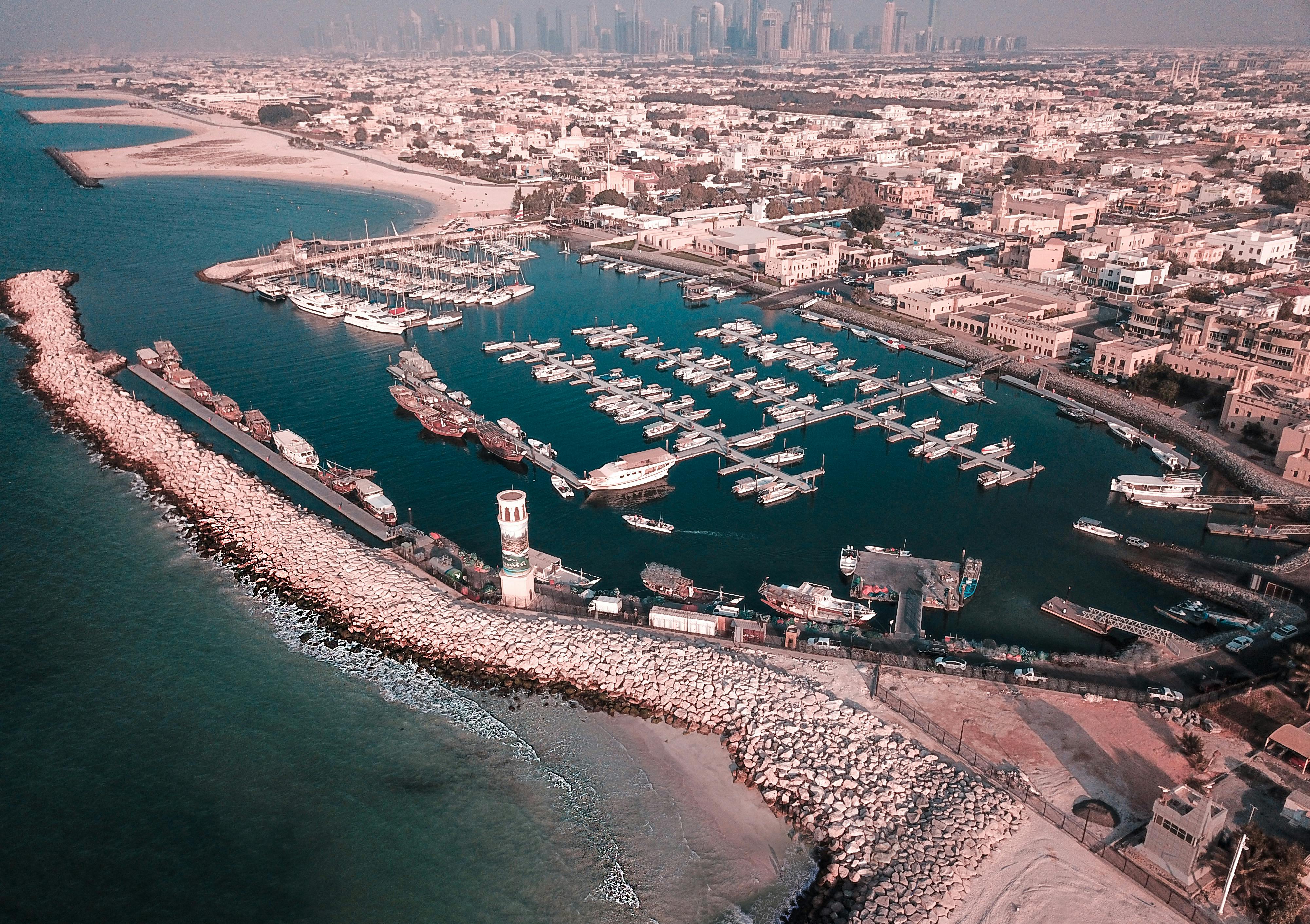 aerial photography of body of water surrounded with boats and buildings