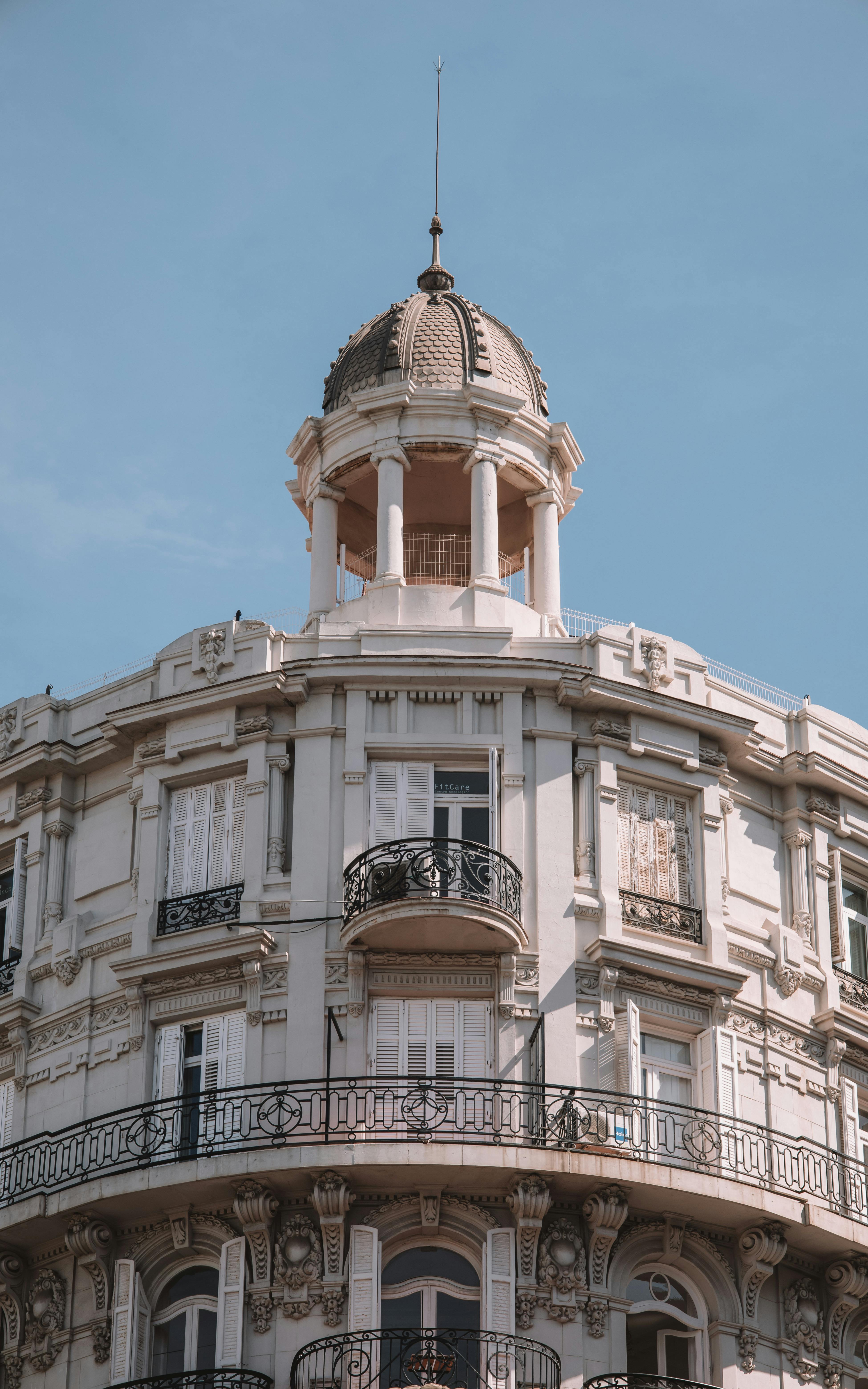 Free Neoclassical architecture of Valencia's corner building with ornate details. Stock Photo