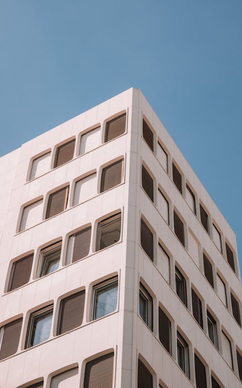 Clear Sky over Sunlit Building Corner