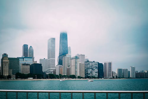 Free High Rise Buildings Near Body of Water Stock Photo