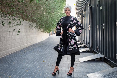 Woman In Floral Robe Posing For Photo