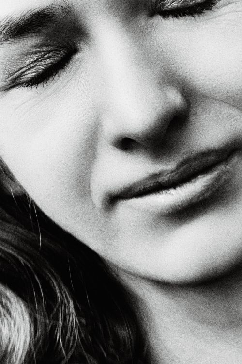 Free Intimate black and white close-up portrait of a woman with eyes closed, revealing deep emotion. Stock Photo