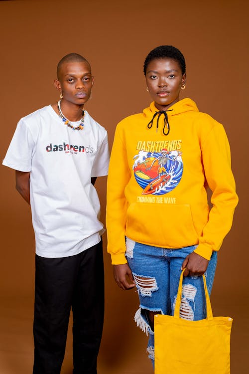 Studio Shot of a Young Man and Woman in Casual Clothes 