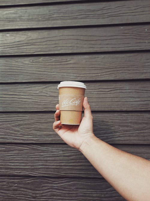Hand Holding Paper Cup