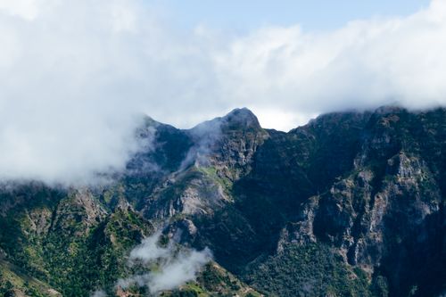 Free Stunning view of cloud-covered mountain peaks in Santana, Madeira, Portugal. Stock Photo