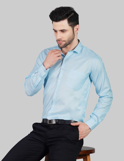 Man Posing in Blue Shirt