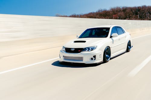 White Subaru Impreza on a Highway