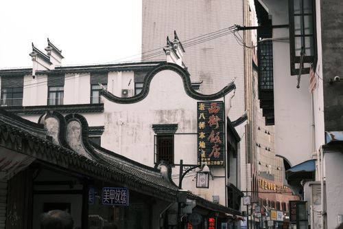 Free Explore a traditional Asian street with unique architectural facades and vibrant signs. Stock Photo