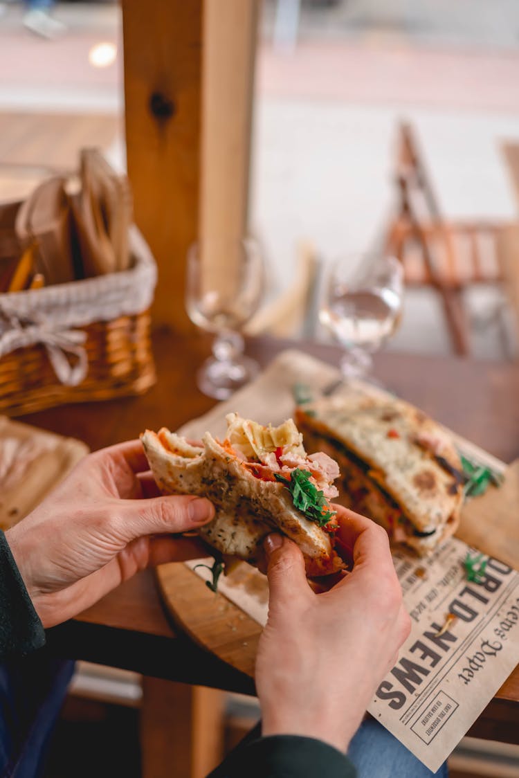 Man Eating A Sandwich At The Restaurant 