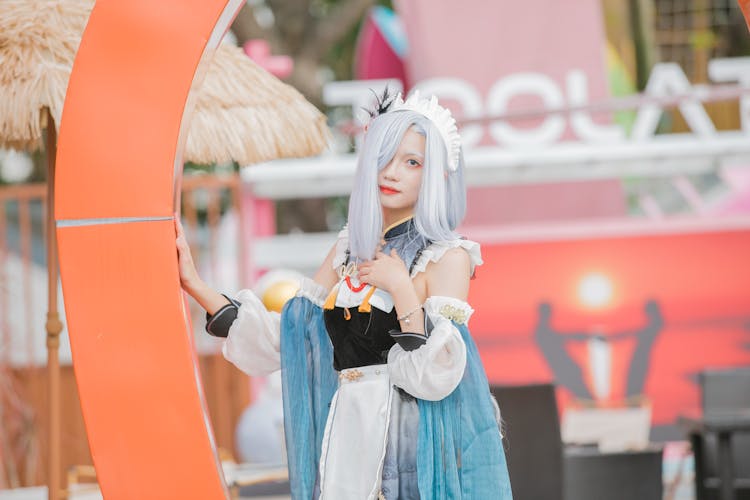 Teenage Girl In Costume Of A Video Game Character Posing At A Cosplay Festival