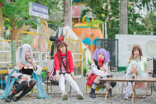 Explore colorful anime cosplay with anime characters enjoying a lively day outdoors in costume.