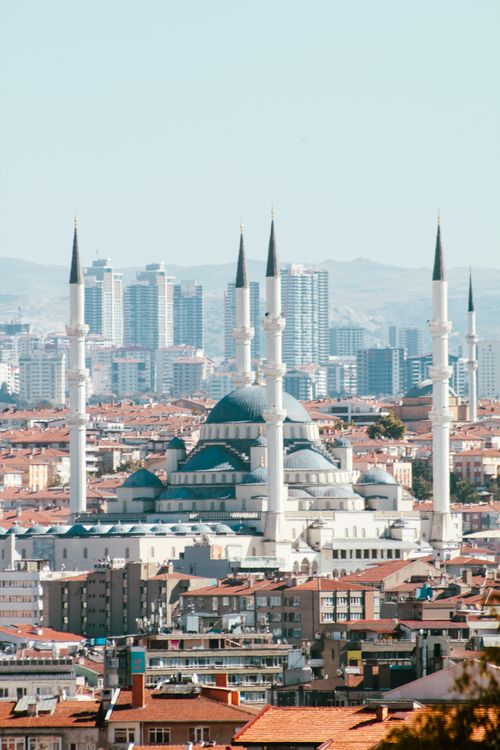Free A stunning panoramic cityscape featuring the Kocatepe Mosque amidst Ankara's urban skyline, under a clear blue sky. Stock Photo
