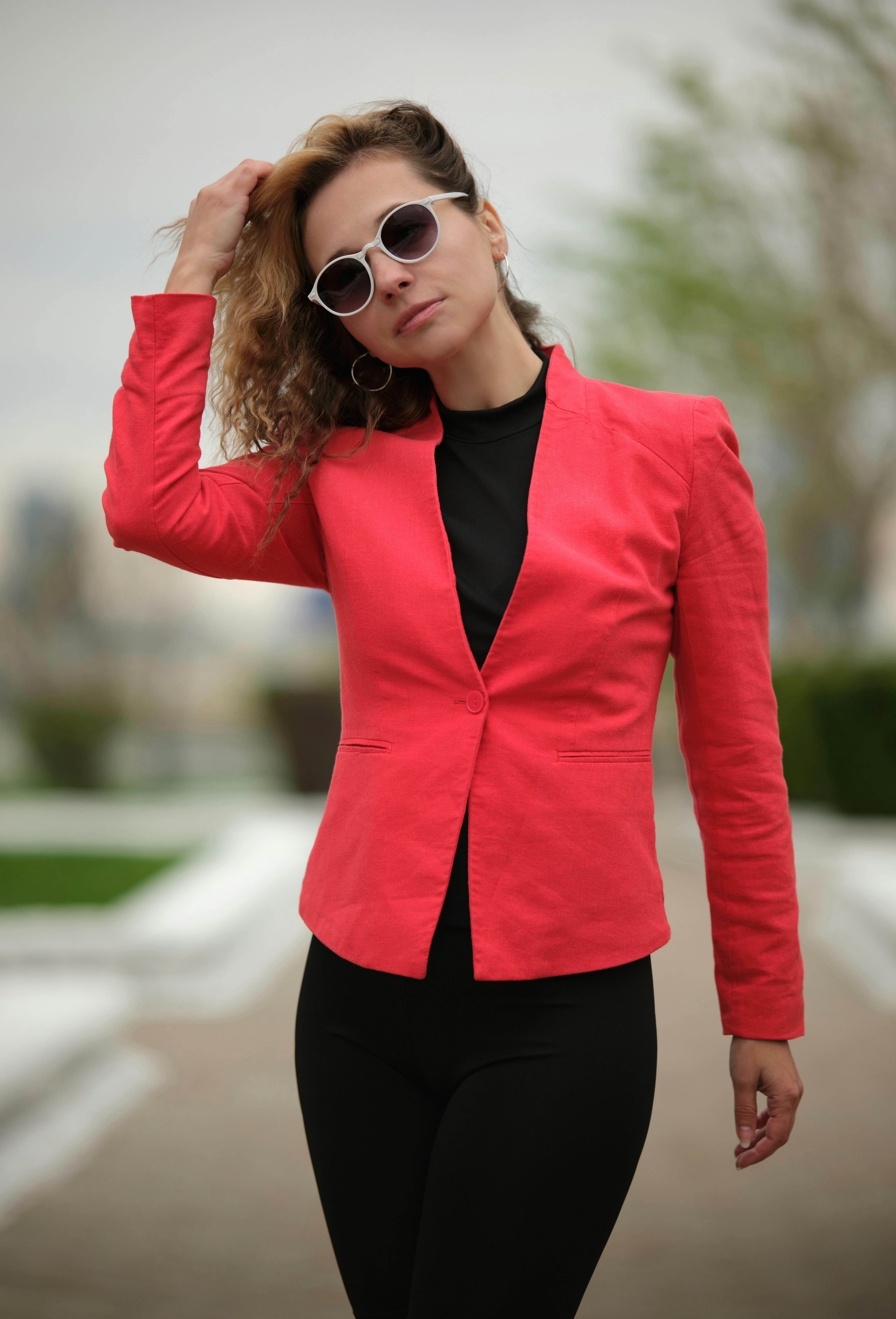 Photo of a Woman Wearing Red Jacket and Sunglasses · Free Stock Photo