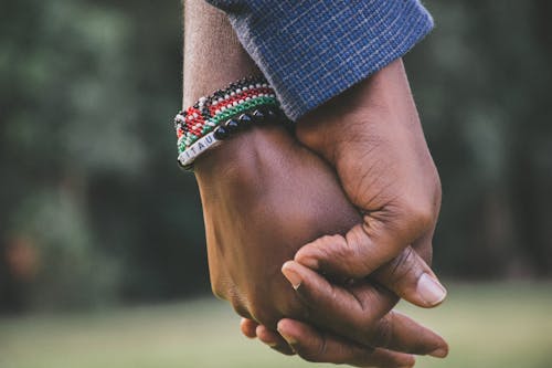 Two people holding hands.