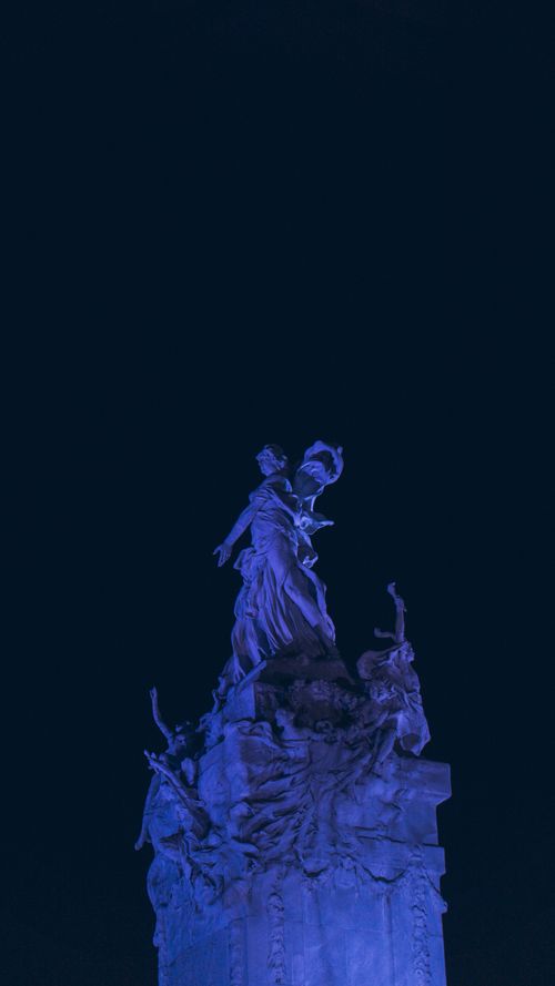Free Sculpture in blue light at night in Buenos Aires, showcasing artistic urban architecture. Stock Photo