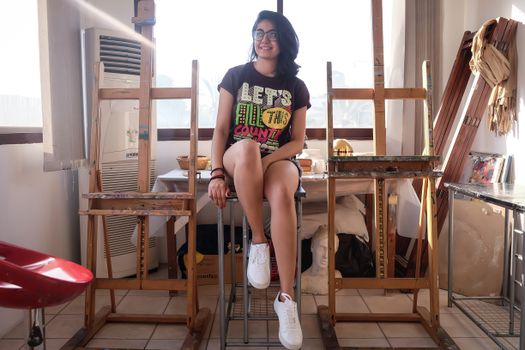 Woman Sitting on Stool