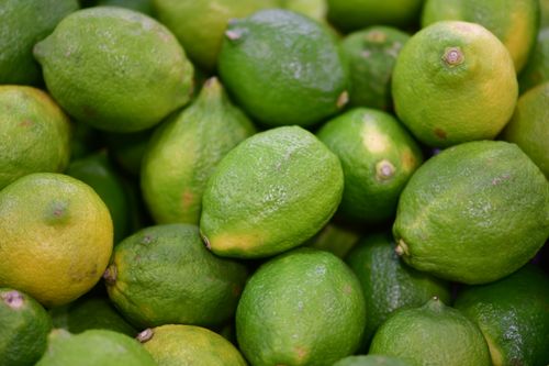 Free Vibrant green limes in abundance at Datong Market, Taipei. Perfect for fresh citrus themes. Stock Photo