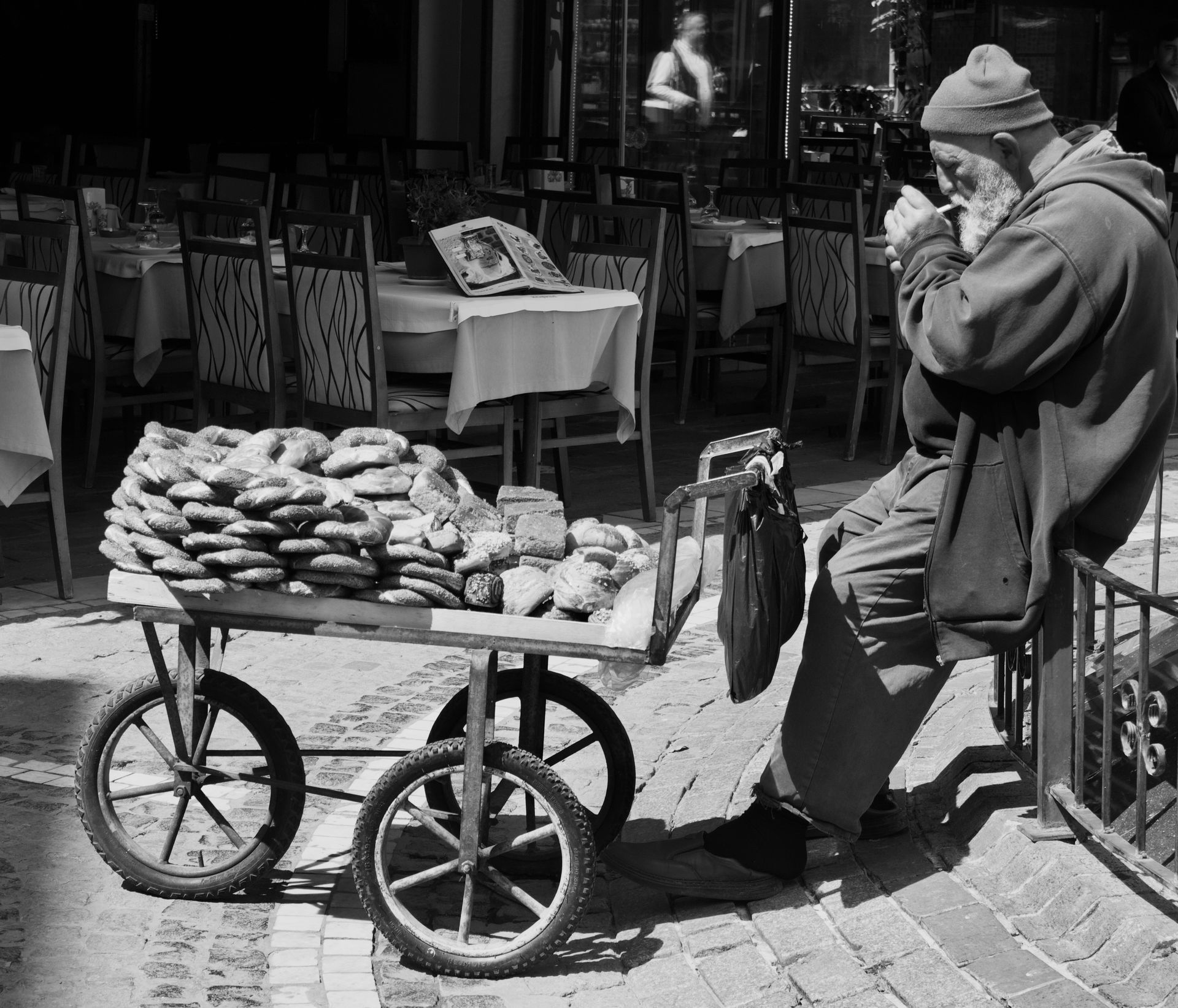 Elderly Man Selling Baked Goods on the Street