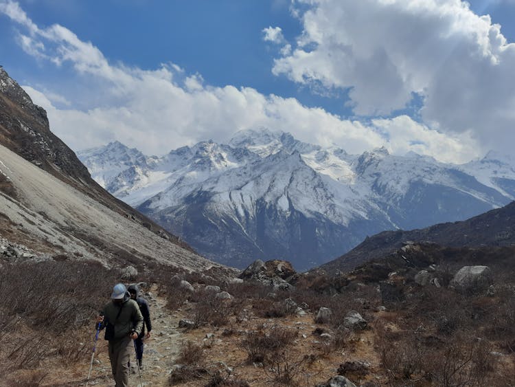 People Hiking In Mountains