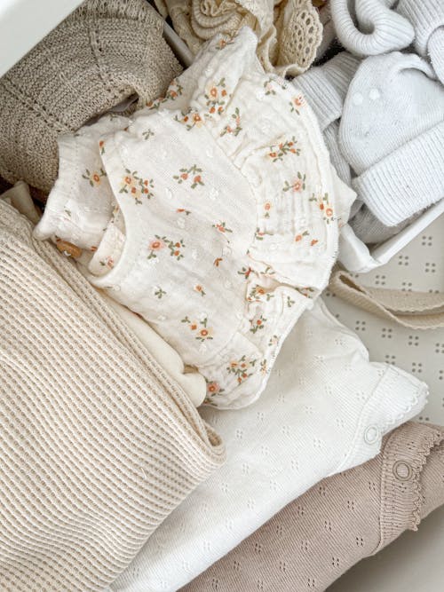 Close-up of Baby Clothes in Neutral Colors
