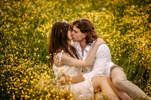 Couple Kissing on Meadow