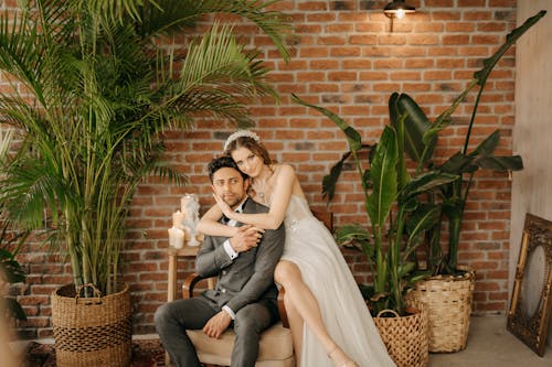 Smiling Newlyweds Hugging on Armchair