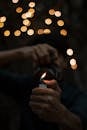Person Holding Lighted Disposable Lighter