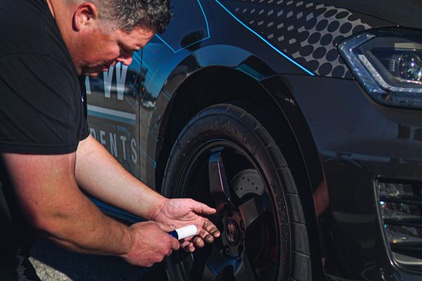 Technician checking a tire
