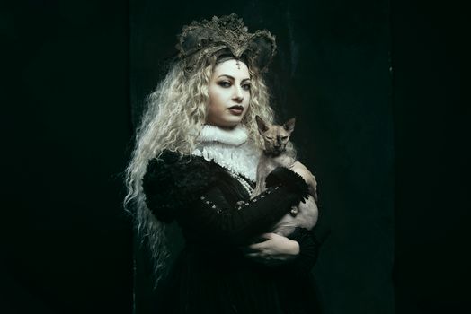 A mysterious woman in a crown holds a cat, embodying a gothic royal theme.