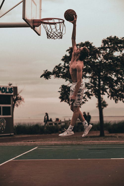 Photo of a Man Playing Basketball 