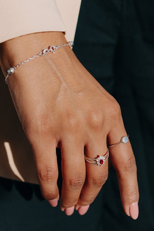 Free Close-up of Hand of a Woman Wearing a Bracelet and Rings  Stock Photo