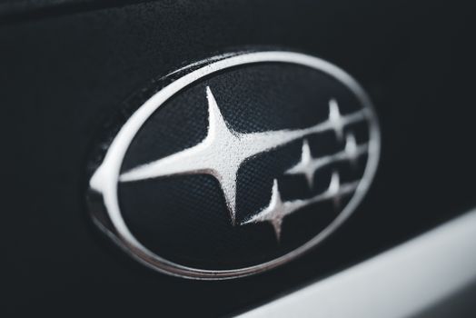 Detailed close-up of a Subaru car emblem, perfect for automotive branding and design themes.