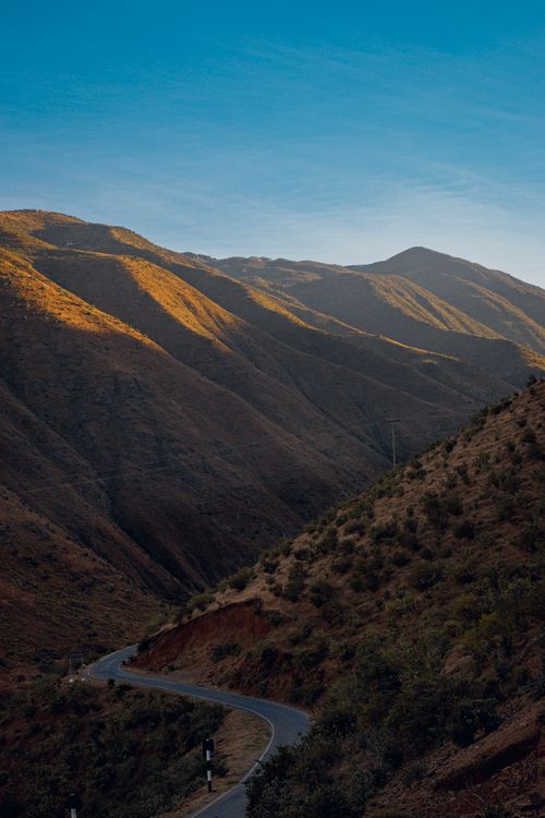 Free A stunning view of a winding road through the hills of Ica, Peru, showcasing nature's beauty. Stock Photo