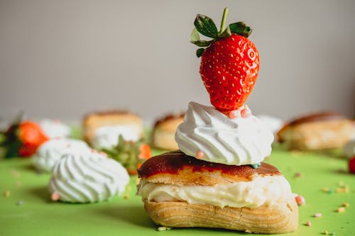Small Eclair Topped with Meringue and Strawberry