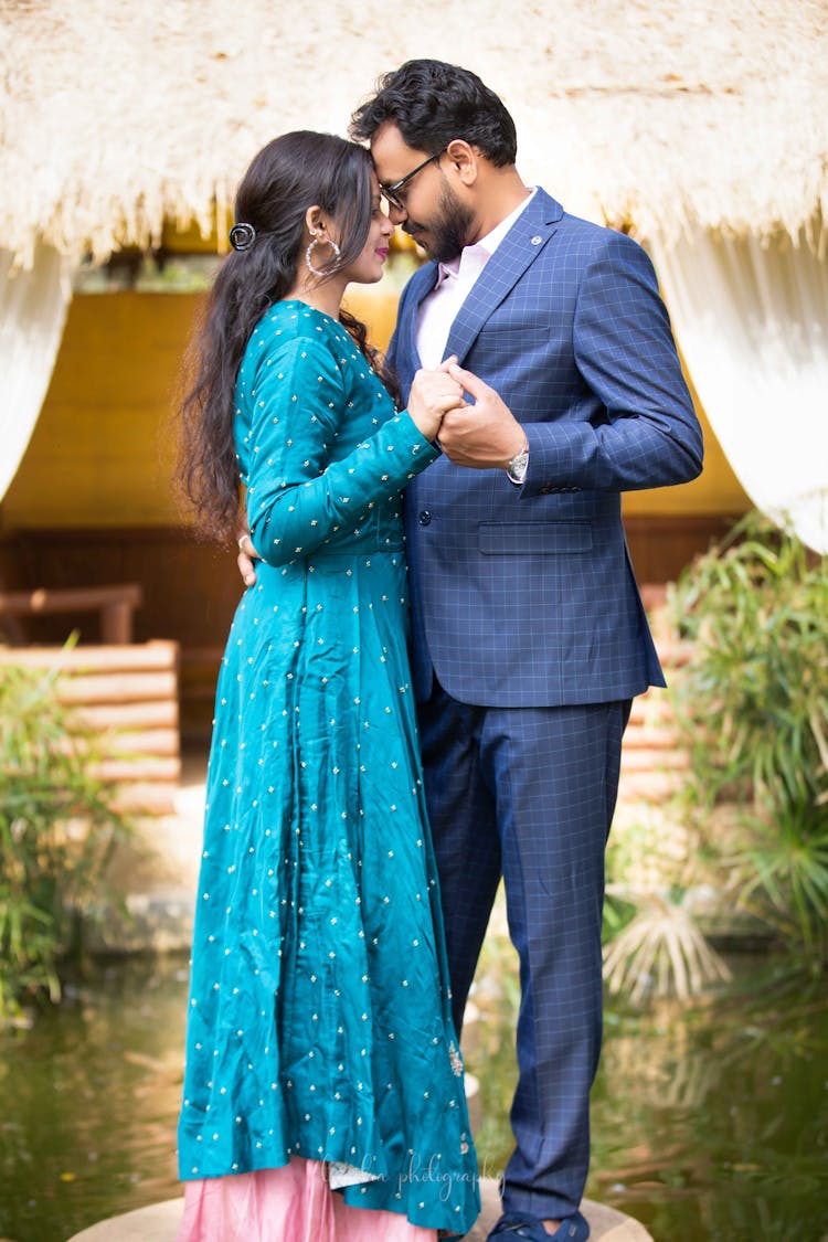 Woman In A Blue Dress And Man In A Suit Dancing 