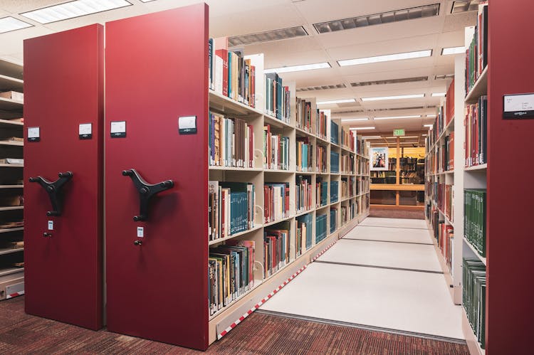 Rows Of Bookshelves In A College Library 