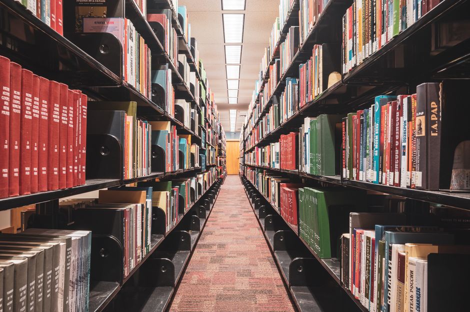 A long library hallway lined with books, illustrating the idea of a large context window