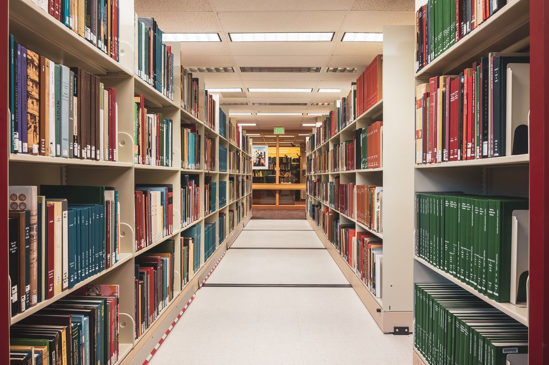 View of Rows of Bookshelves in a College Library · Free Stock Photo