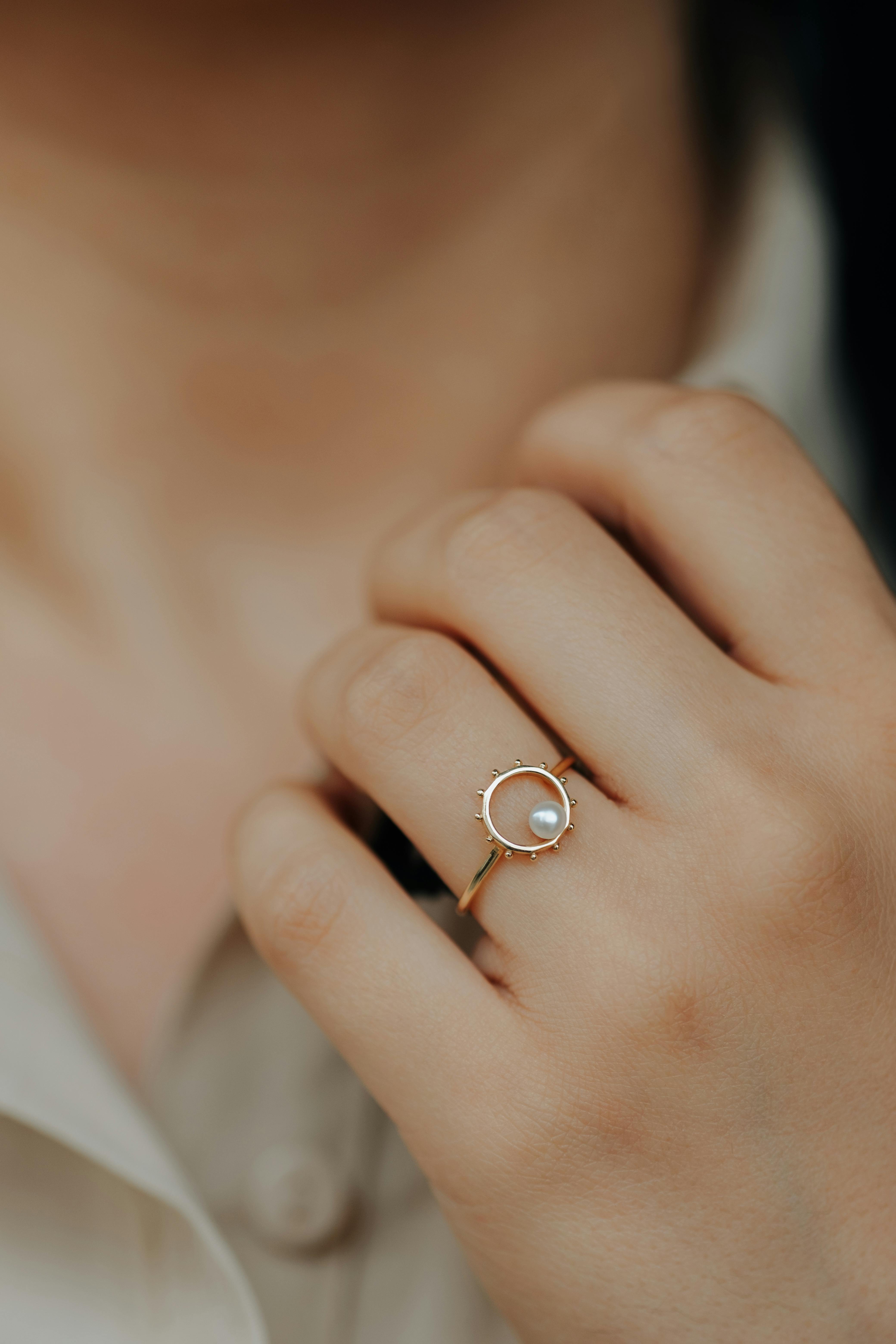 gold ring on hand of woman